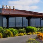 View of the Anthony's at Squalicum Harbor restaurant with well-maintained landscaping along the entry-way.